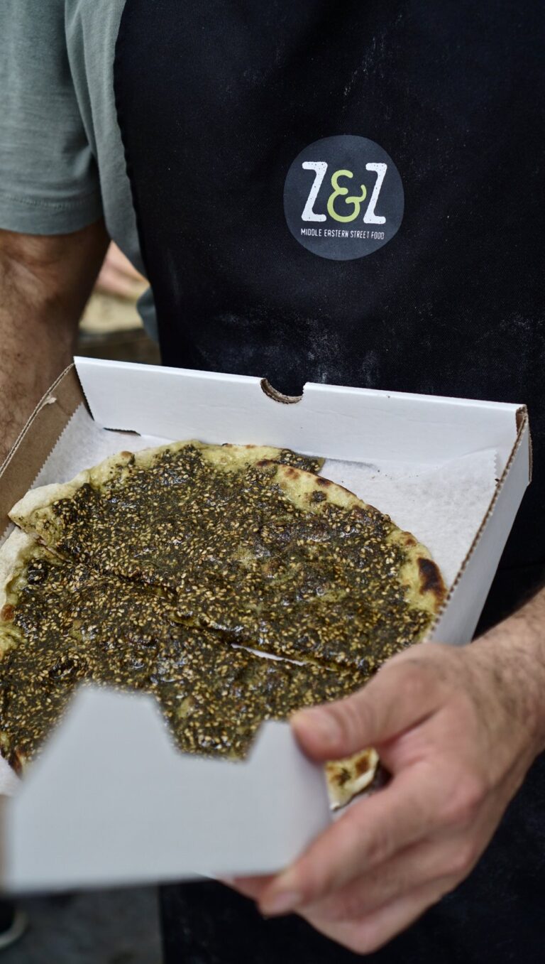 Z Z Manoushe in hand 768x1357